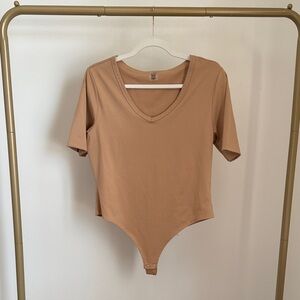 Elegant Tan V-Neck Bodysuit